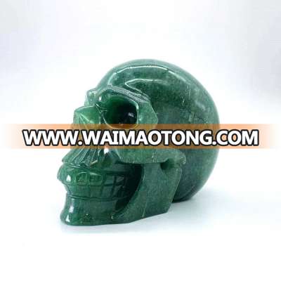 Wholesale natural hand carved crystal green strawberry stone skulls crystal craft skull for decoration